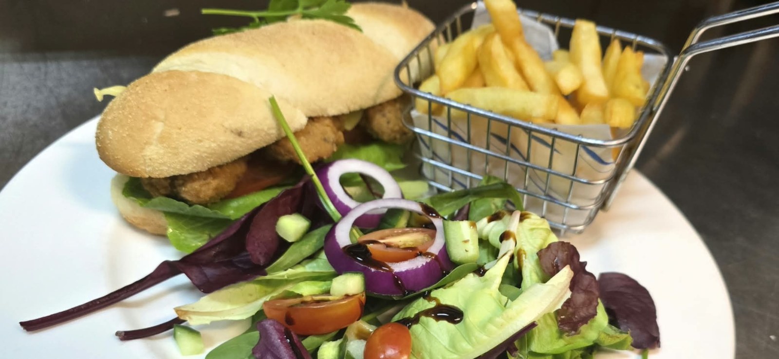 Southern fried chicken sub roll with fries and side salad