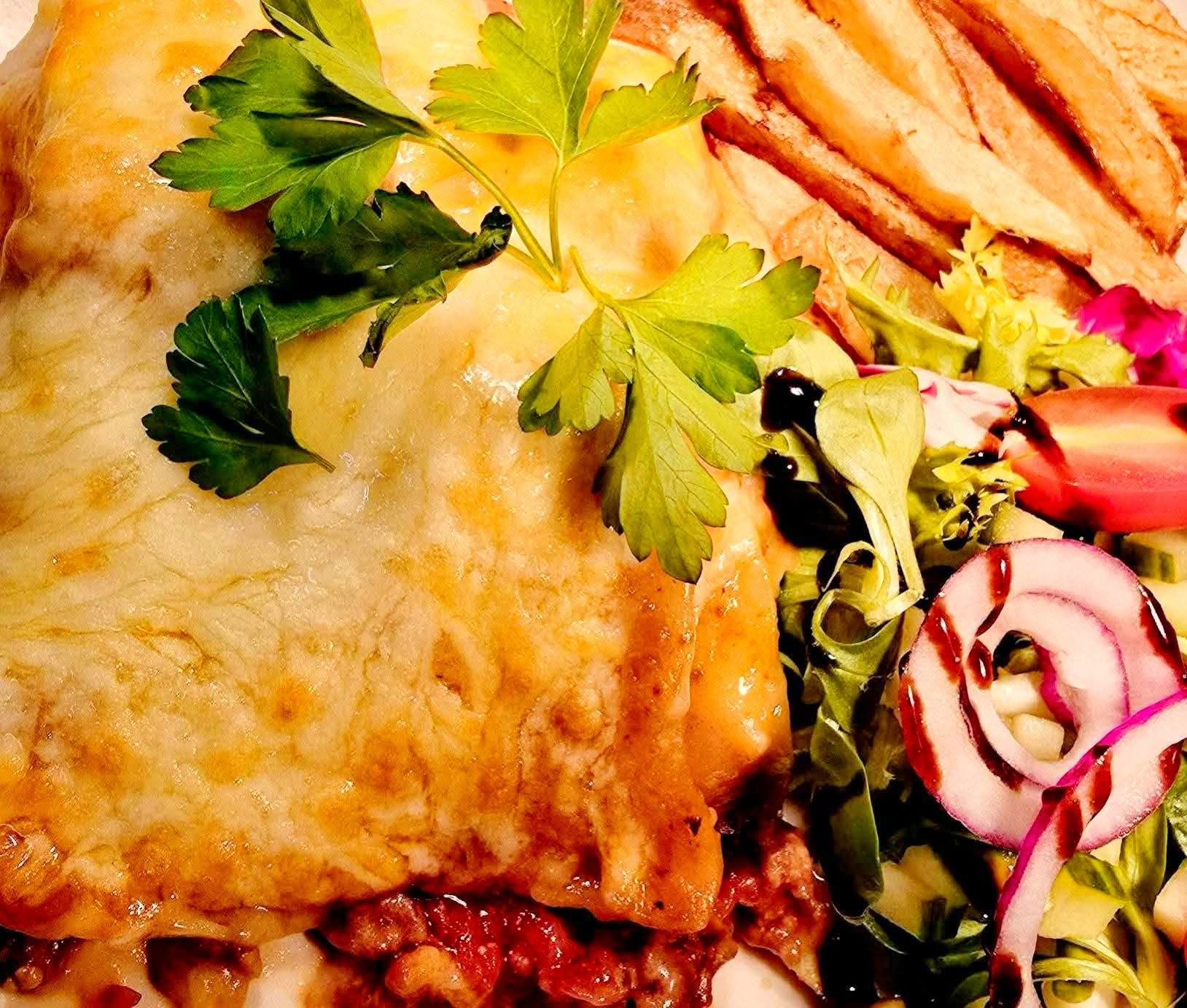 Lasagne served with fresh salad